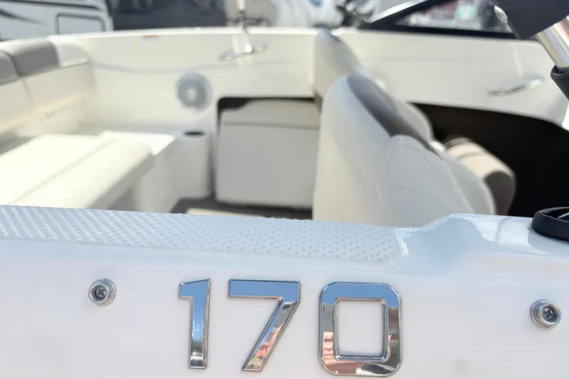 Slide: The Image of 2020 Bayliner 170 Bowrider interior with seating and chrome model number detail. - 14