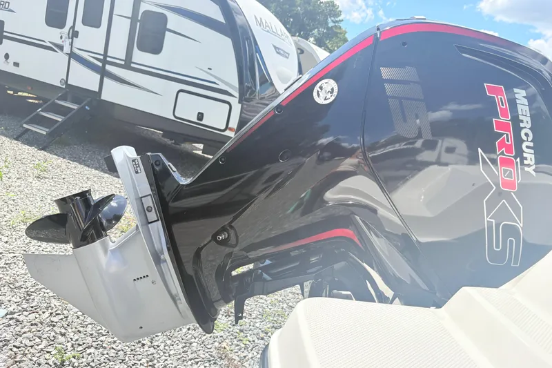 Slide: The Image of 2020 Bayliner 170 Bowrider with Mercury Pro XS outboard motor, parked near a trailer. - 16