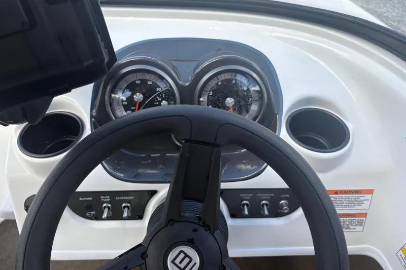 Slide: The Image of Dashboard of 2020 Bayliner 170 Bowrider with steering wheel and gauges. - 3