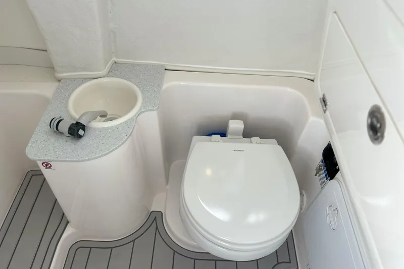 Slide: The Image of 2026 Sea Fox 268 Commander boat bathroom with sink and toilet. - 23