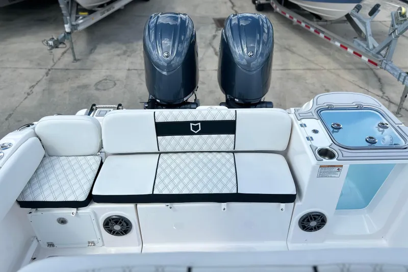 Slide: The Image of 2026 Sea Fox 268 Commander boat interior with dual engines and seating area. - 26
