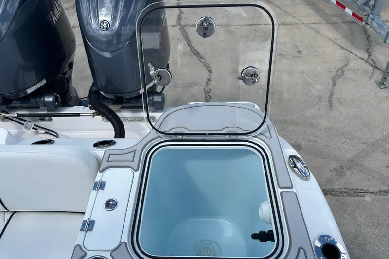 Slide: The Image of 2026 Sea Fox 268 Commander boat with open storage compartment and dual outboard engines. - 30