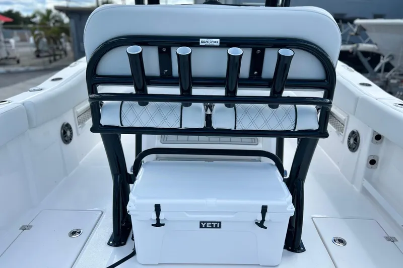 Slide: The Image of 2026 Sea Fox 268 Commander boat interior with rod holders and Yeti cooler. - 31