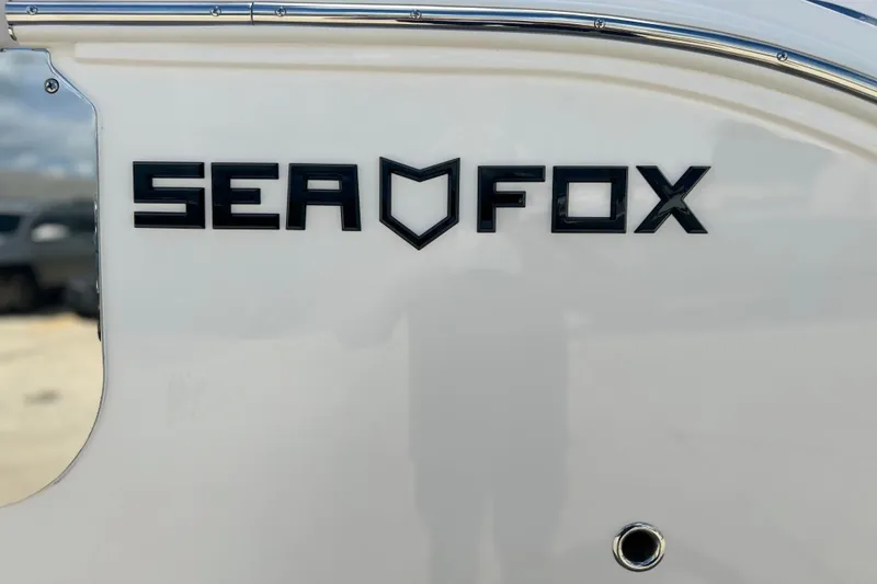Slide: The Image of Sea Fox 268 Commander 2026 logo on white boat exterior. - 37