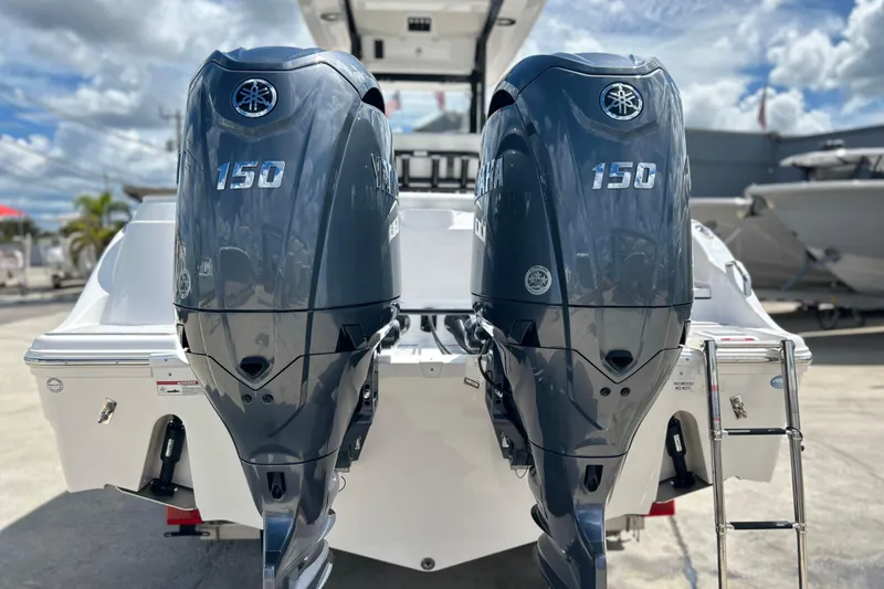 Slide: The Image of 2026 Sea Fox 268 Commander with dual Yamaha 150 engines, docked under a cloudy sky. - 39