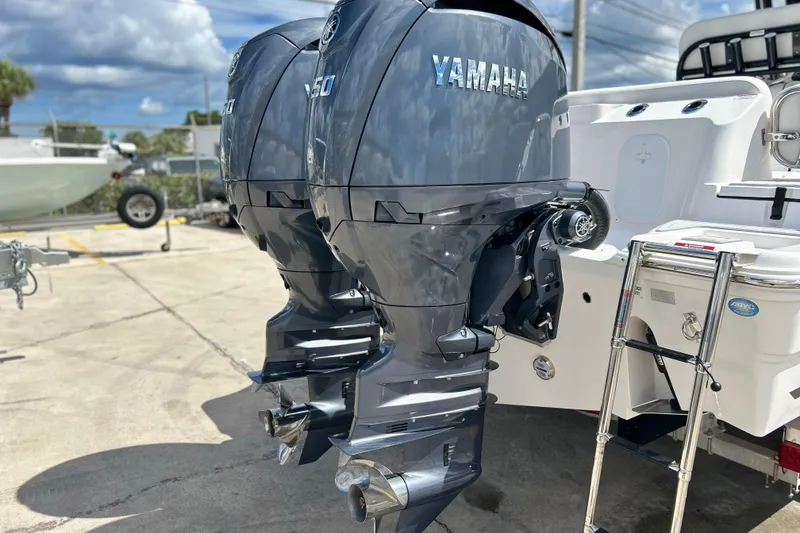 Slide: The Image of Twin Yamaha outboard engines on a 2026 Sea Fox 268 Commander boat, dockside view. - 41