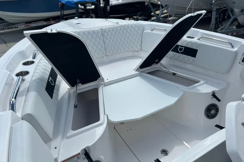Slide: The Image of 2026 Sea Fox 268 Commander boat interior with open storage compartments and seating. - 8