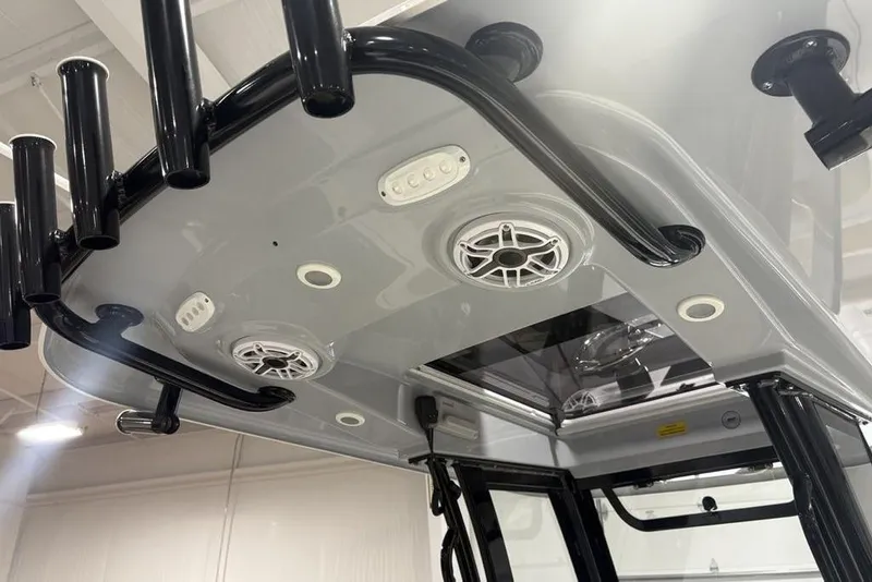 Slide: The Image of 2025 Sportsman Masters 267OE Bay Boat T-top with rod holders and speakers. - 16