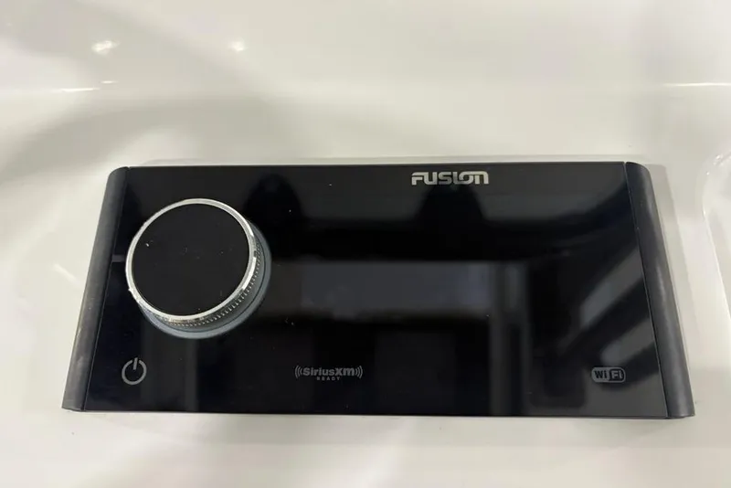 Slide: The Image of Fusion audio control panel on 2025 Sportsman Masters 267OE Bay Boat. - 18