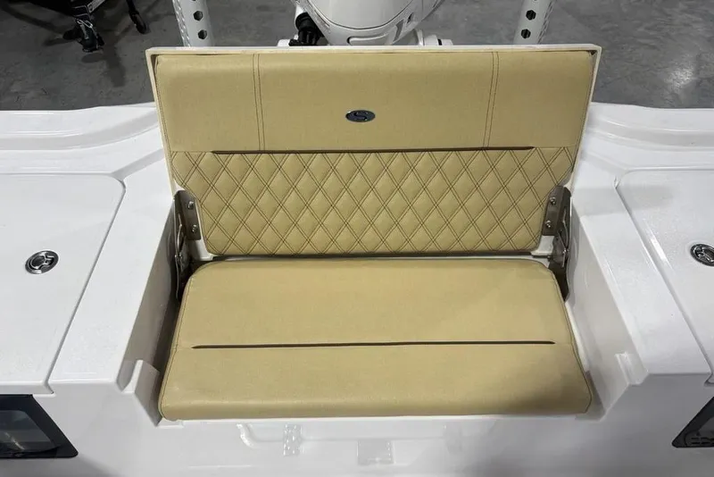 Slide: The Image of 2025 Sportsman Masters 267OE Bay Boat seat with beige diamond-patterned upholstery. - 21