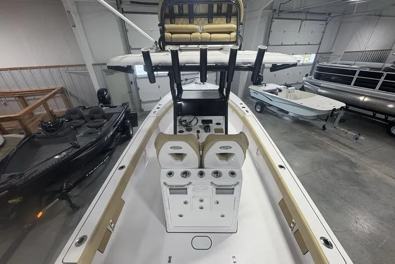 Slide: The Image of 2025 Sportsman Masters 267OE Bay Boat interior in showroom, featuring helm and seating. - 29