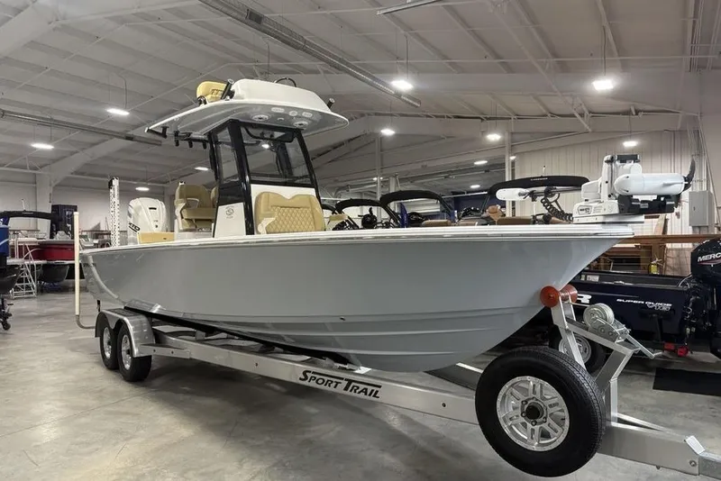 Slide: The Image of 2025 Sportsman Masters 267OE Bay Boat on trailer in indoor showroom. - 6