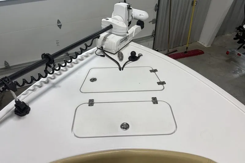 Slide: The Image of 2025 Sportsman Masters 267OE Bay Boat bow with trolling motor and storage hatches. - 7