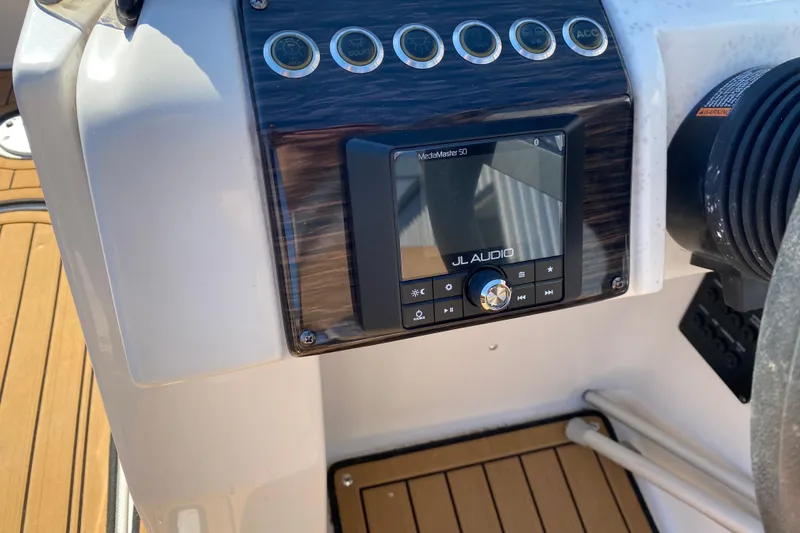 Slide: The Image of Control panel of 2022 Starcraft Star Step 221 E I/O boat with JL Audio system. - 12