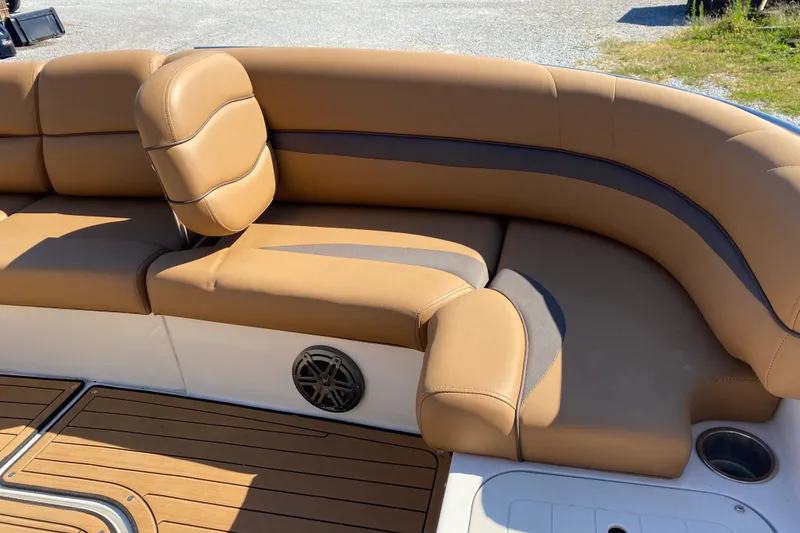 Slide: The Image of 2022 Starcraft Star Step 221 E I/O boat with tan leather seating and wood deck. - 16