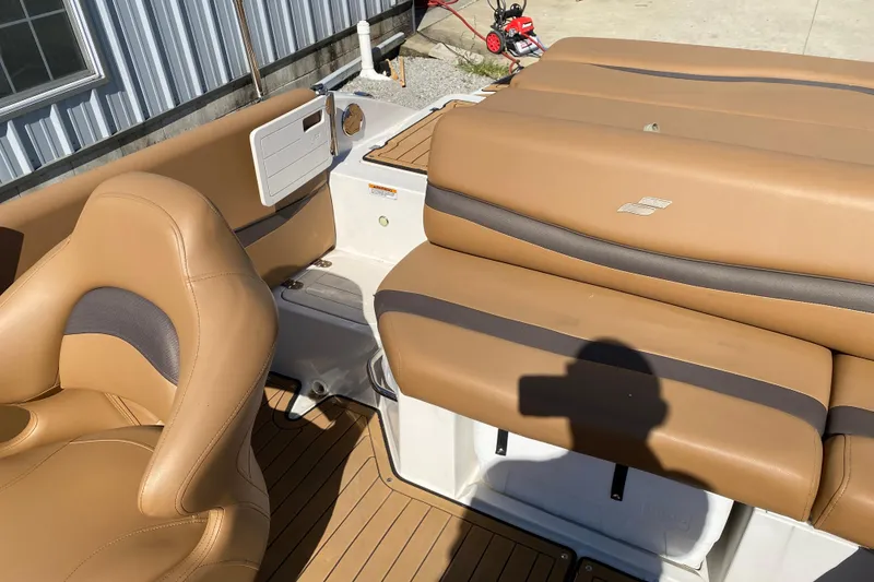 Slide: The Image of 2022 Starcraft Star Step 221 E I/O boat interior with tan seating and deck. - 20