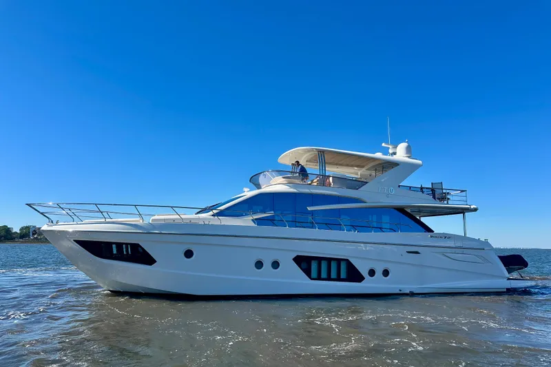 Slide: The Image of Luxury 2016 Absolute 72 FLY yacht cruising on clear blue waters. - 10