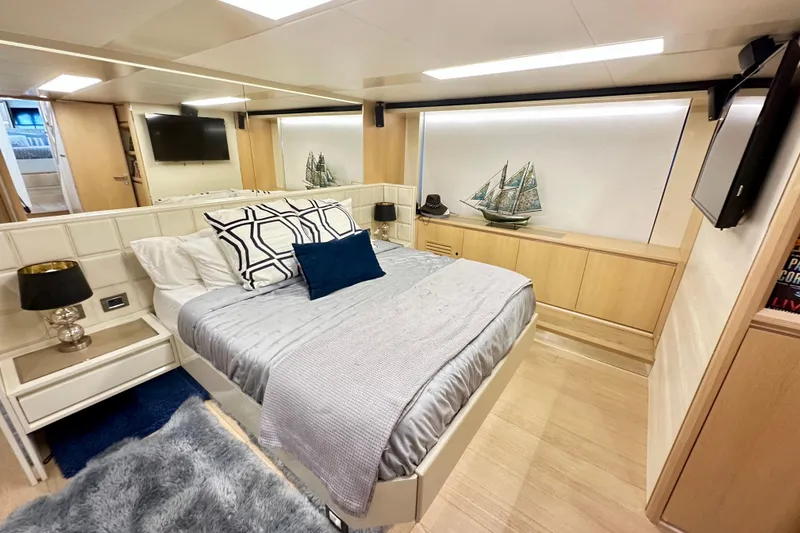 Slide: The Image of Luxurious bedroom interior on 2016 Absolute 72 FLY yacht, featuring modern decor and elegant furnishings. - 100