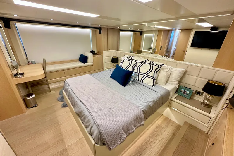 Slide: The Image of Luxurious bedroom interior on 2016 Absolute 72 FLY yacht with modern decor and cozy ambiance. - 103