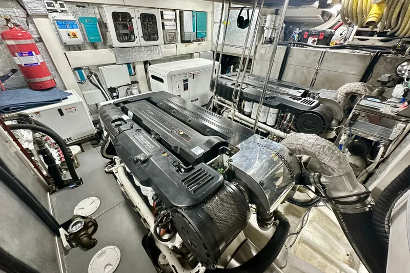 Slide: The Image of Engine room of 2016 Absolute 72 FLY yacht, featuring dual engines and equipment. - 12