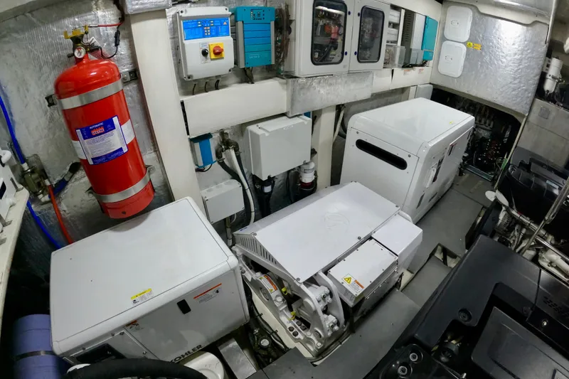 Slide: The Image of Engine room of 2016 Absolute 72 FLY yacht with equipment and fire extinguisher. - 122