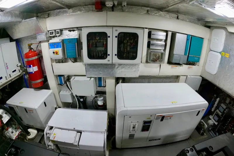 Slide: The Image of Engine room of 2016 Absolute 72 FLY yacht with Kohler generator and control panels. - 123