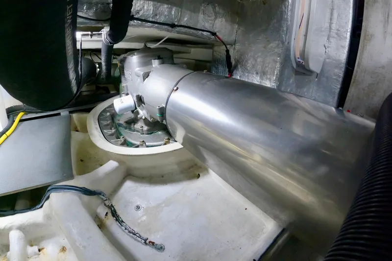 Slide: The Image of Engine room of 2016 Absolute 72 FLY yacht, showcasing mechanical components and piping. - 131