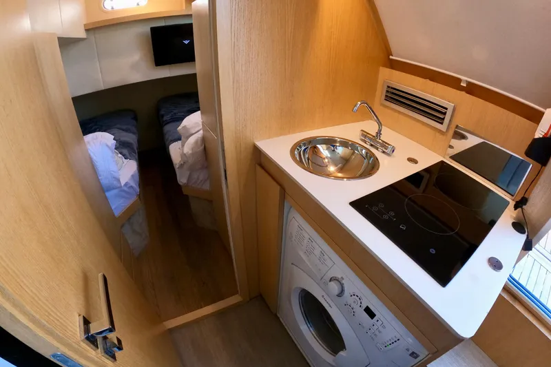 Slide: The Image of Compact kitchen and sleeping area in 2016 Absolute 72 FLY yacht interior. - 135