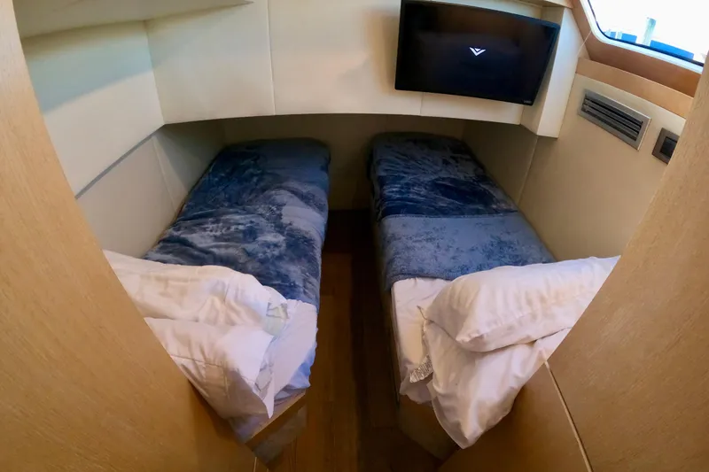 Slide: The Image of Twin beds in a cozy cabin of a 2016 Absolute 72 FLY yacht. - 136