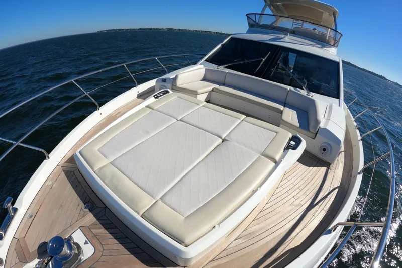 Slide: The Image of Luxury Absolute 72 FLY yacht deck with sunbed, 2016 model, cruising on open water. - 138
