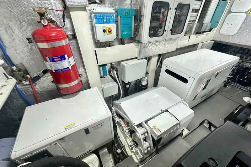 Slide: The Image of Engine room of 2016 Absolute 72 FLY yacht with fire extinguisher and equipment. - 14