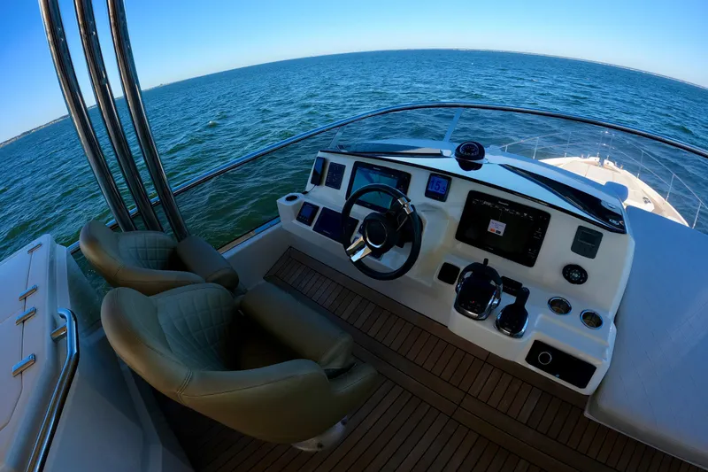 Slide: The Image of Cockpit view of 2016 Absolute 72 FLY yacht with ocean backdrop. - 142