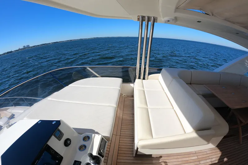 Slide: The Image of Luxurious 2016 Absolute 72 FLY yacht deck with ocean view and comfortable seating. - 143