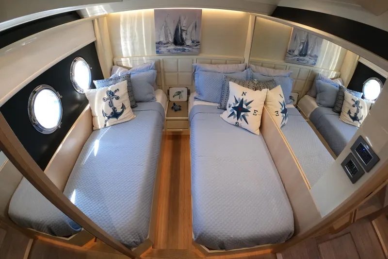 Slide: The Image of Luxurious twin cabin on 2016 Absolute 72 FLY yacht with nautical decor. - 147