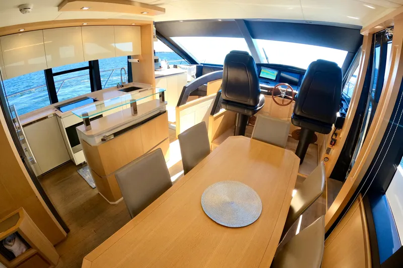 Slide: The Image of Luxurious interior of 2016 Absolute 72 FLY yacht with dining area and helm. - 151