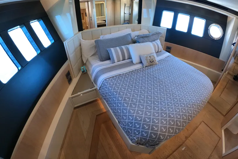 Slide: The Image of Luxurious bedroom interior of 2016 Absolute 72 FLY yacht with elegant bedding and ample natural light. - 153