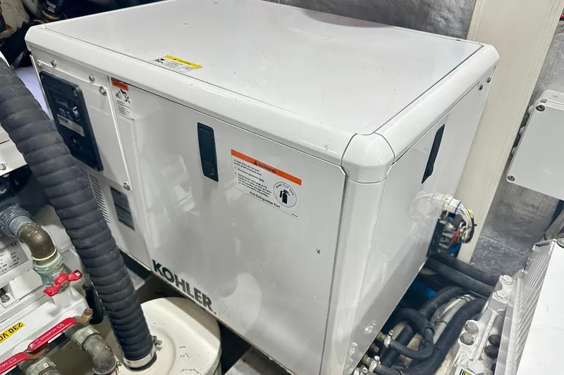 Slide: The Image of Engine room of 2016 Absolute 72 FLY yacht featuring Kohler generator. - 31