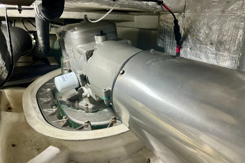 Slide: The Image of Engine room of a 2016 Absolute 72 FLY yacht, showcasing mechanical components. - 33