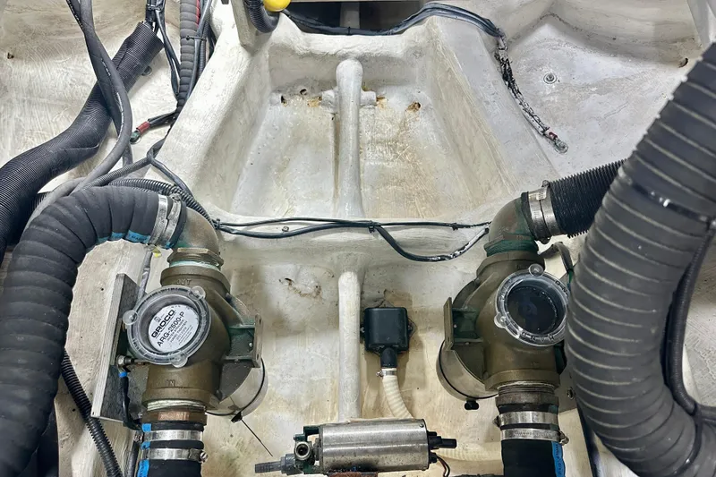 Slide: The Image of Engine compartment of a 2016 Absolute 72 FLY yacht, showing mechanical components and hoses. - 36