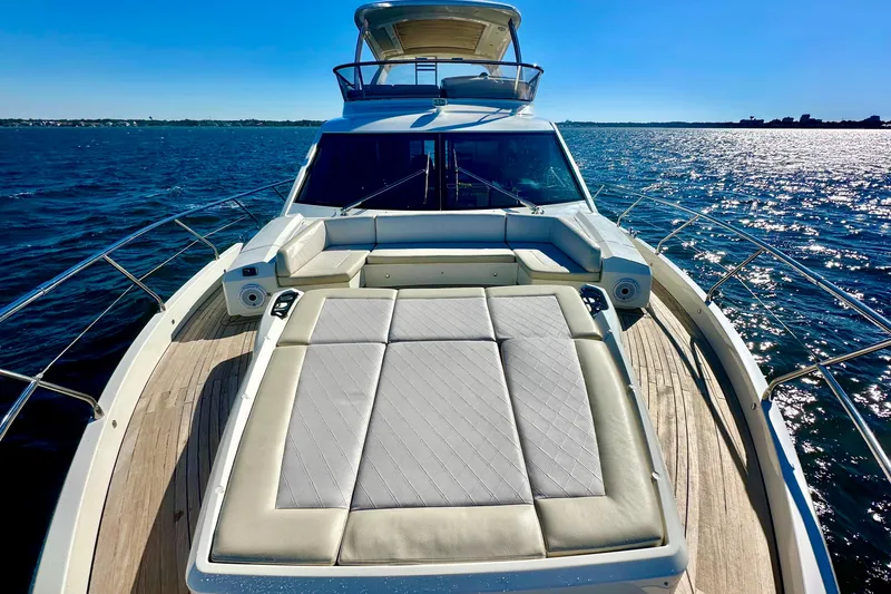 Slide: The Image of Luxurious 2016 Absolute 72 FLY yacht on open water, featuring spacious sunbathing deck. - 47