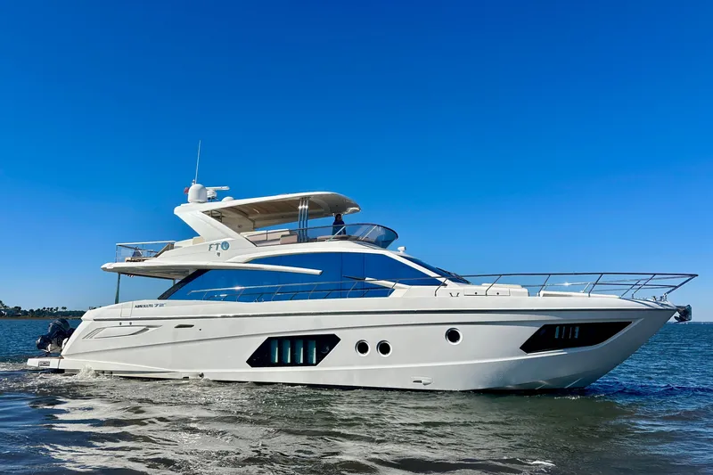 Slide: The Image of Luxury yacht Absolute 72 FLY 2016 cruising on open water under clear blue sky. - 5