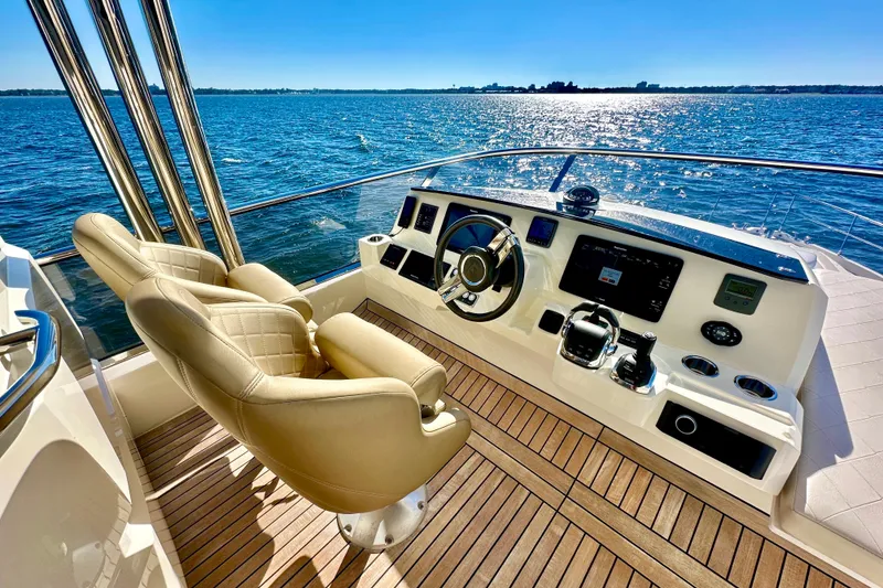 Slide: The Image of Luxurious helm of 2016 Absolute 72 FLY yacht with ocean view and modern controls. - 51