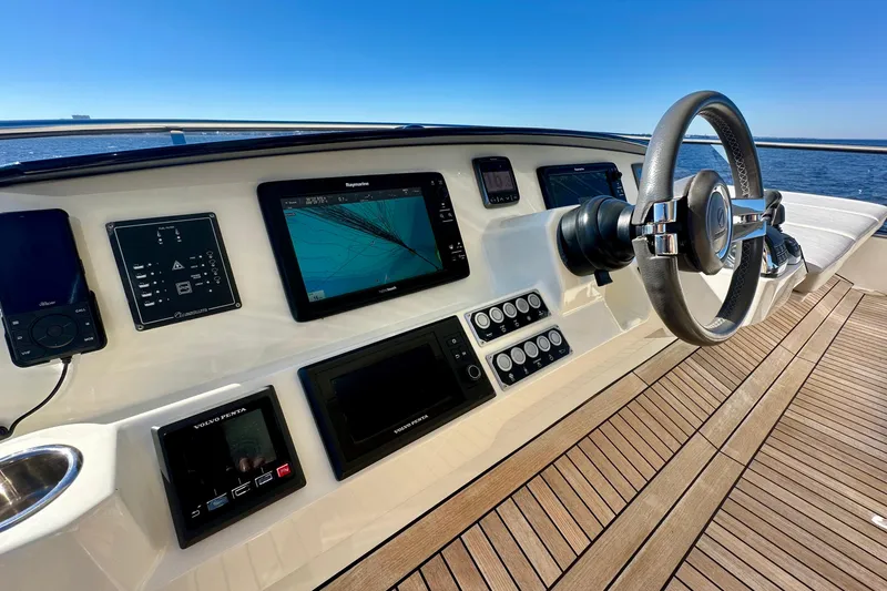 Slide: The Image of Helm of 2016 Absolute 72 FLY yacht with navigation screens and steering wheel. - 54