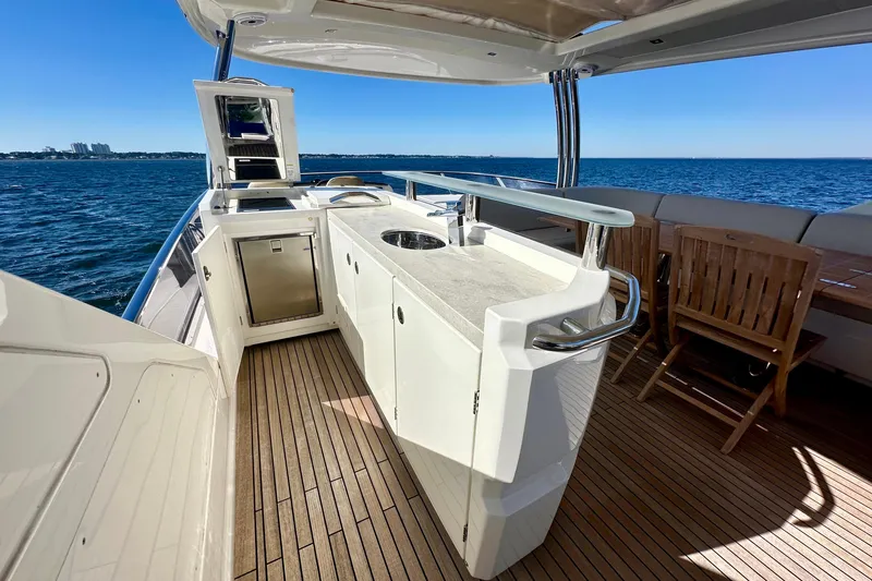 Slide: The Image of Luxurious 2016 Absolute 72 FLY yacht deck with outdoor kitchen and ocean view. - 56