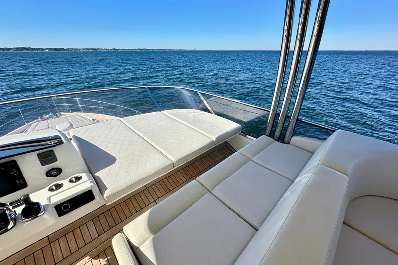 Slide: The Image of Luxurious 2016 Absolute 72 FLY yacht deck with ocean view and elegant seating. - 59