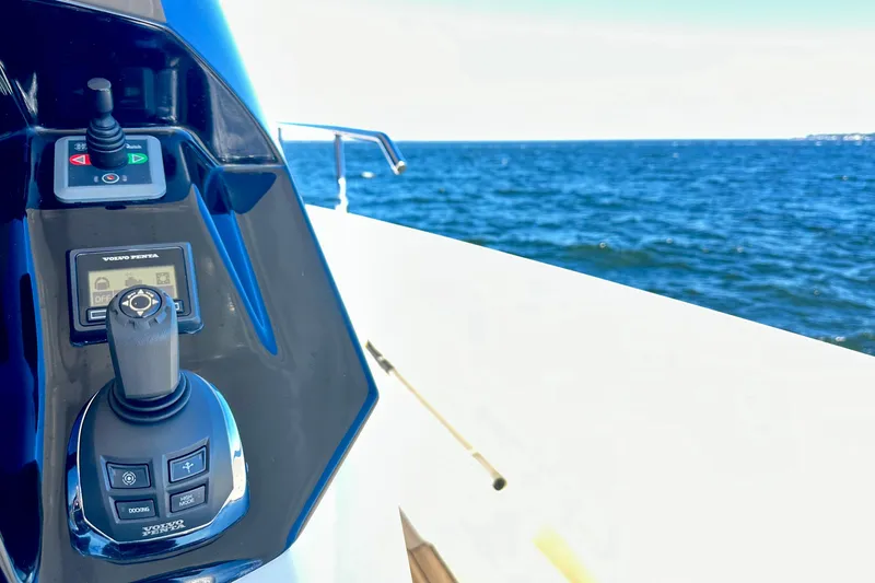 Slide: The Image of Control panel of 2016 Absolute 72 FLY yacht with ocean view in background. - 68