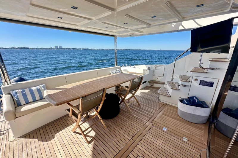 Slide: The Image of Luxurious 2016 Absolute 72 FLY yacht deck with seating, table, and ocean view. - 69