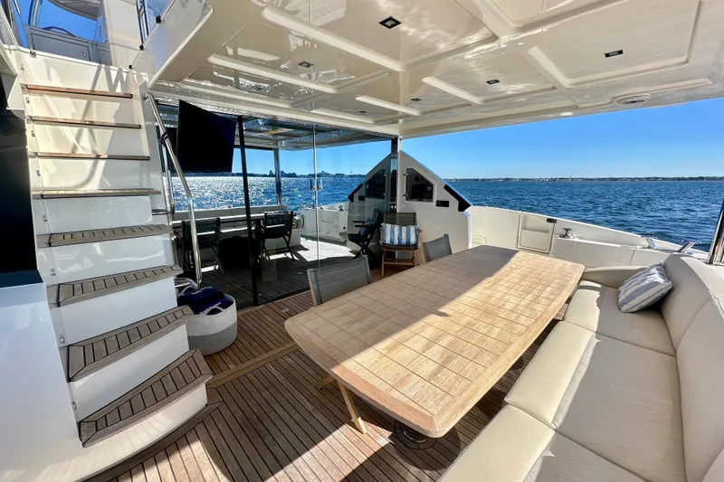 Slide: The Image of Luxurious 2016 Absolute 72 FLY yacht with spacious deck and elegant seating area. - 70