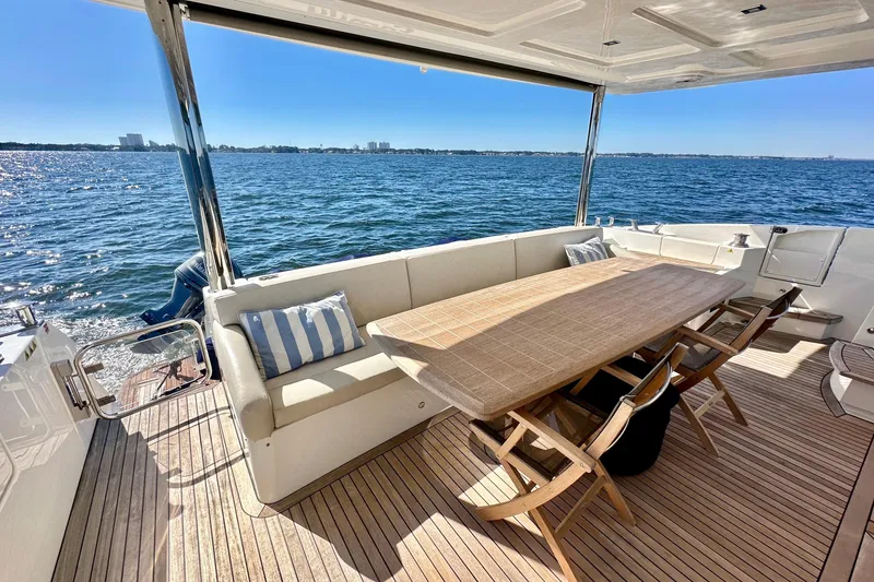 Slide: The Image of Luxurious 2016 Absolute 72 FLY yacht deck with seating and ocean view. - 71