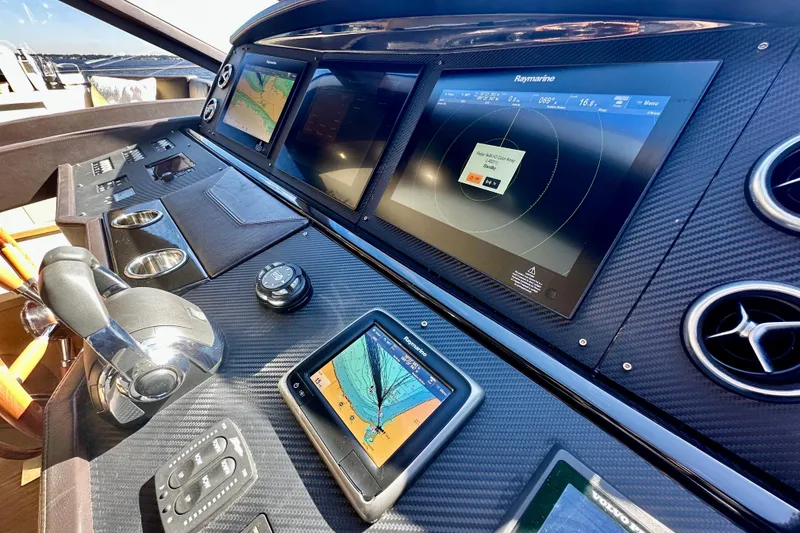 Slide: The Image of Cockpit of 2016 Absolute 72 FLY yacht with advanced navigation displays and controls. - 85